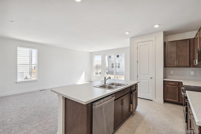 9314 Biscay St, Commerce City, CO 80022 - kitchen with an island with sink, a wealth of natural light, appliances with stainless steel finishes, and a sink