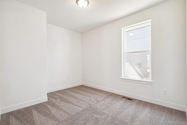 9314 Biscay St, Commerce City, CO 80022 - spare room with a wealth of natural light, visible vents, baseboards, and carpet floors