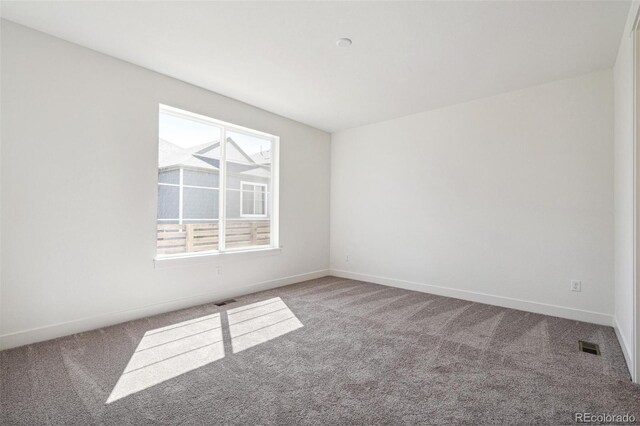 9314 Biscay St, Commerce City, CO 80022 - carpeted empty room with baseboards and visible vents
