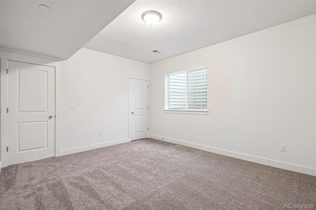 9314 Biscay St, Commerce City, CO 80022 - unfurnished room featuring carpet floors, a textured ceiling, baseboards, and visible vents