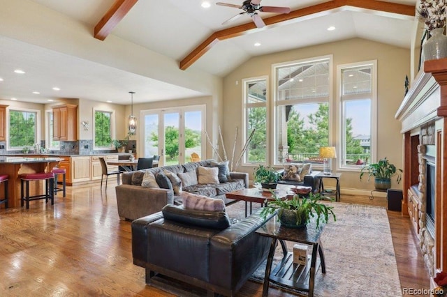 4651 Sonado Pl, Parker, CO 80134 - living area with healthy amount of natural light, a fireplace, a ceiling fan, light wood-type flooring, and recessed lighting