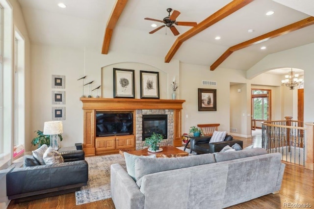4651 Sonado Pl, Parker, CO 80134 - living area with recessed lighting, a chandelier, wood finished floors, a stone fireplace, and a ceiling fan