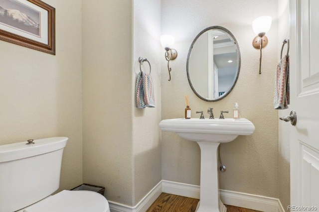 4651 Sonado Pl, Parker, CO 80134 - half bathroom with toilet and wood finished floors