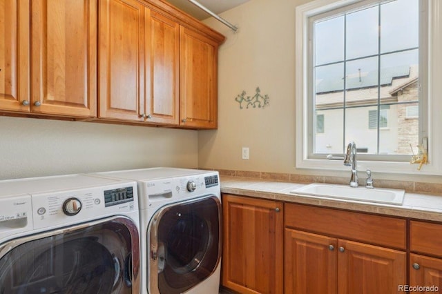 4651 Sonado Pl, Parker, CO 80134 - laundry room featuring cabinet space and washer and dryer