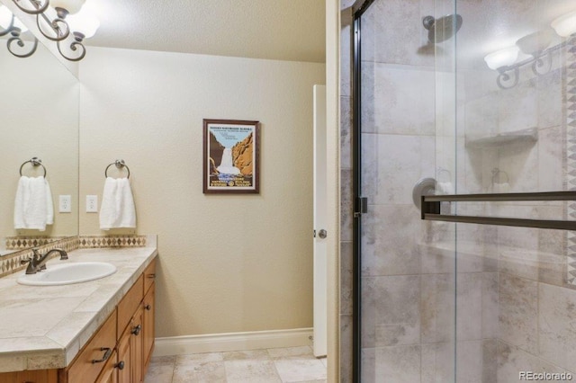 4651 Sonado Pl, Parker, CO 80134 - bathroom featuring vanity, a stall shower, and a chandelier
