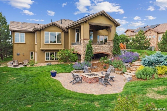 4651 Sonado Pl, Parker, CO 80134 - rear view of house featuring an outdoor fire pit, stucco siding, a patio area, a yard, and stairs