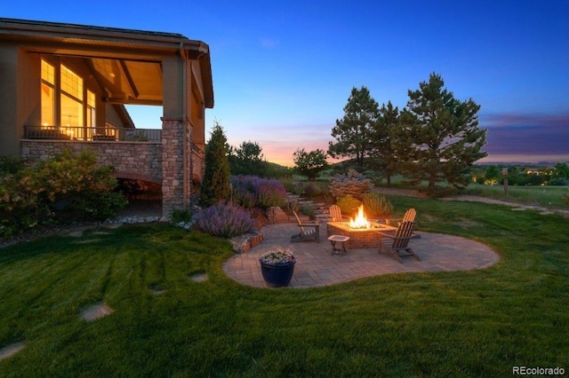 4651 Sonado Pl, Parker, CO 80134 - view of grassy yard with a fire pit and a patio