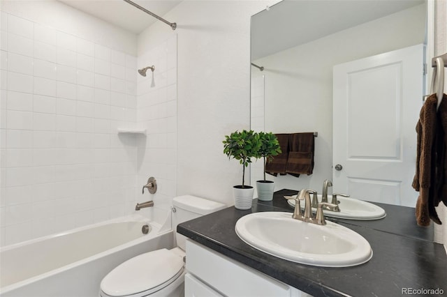 full bath featuring toilet, vanity, and bathtub / shower combination