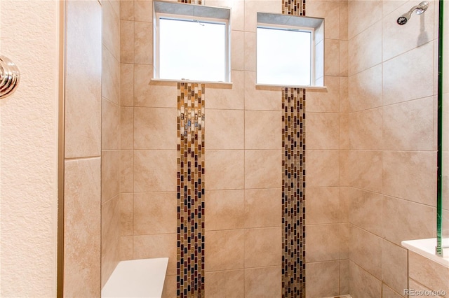 bathroom featuring tiled shower