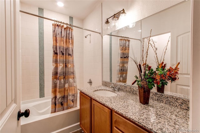 bathroom with vanity and shower / bath combo