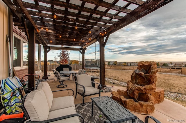 view of patio / terrace featuring an outdoor living space and a pergola