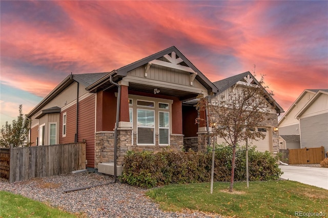 craftsman-style home featuring a yard and a porch