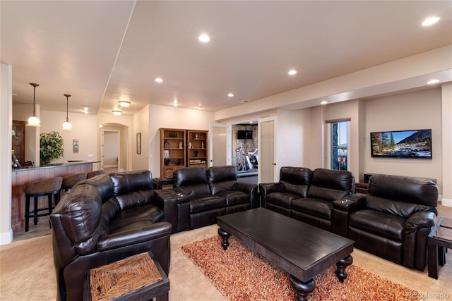 cinema room featuring light carpet