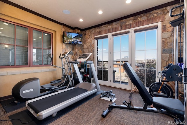 exercise room featuring ornamental molding