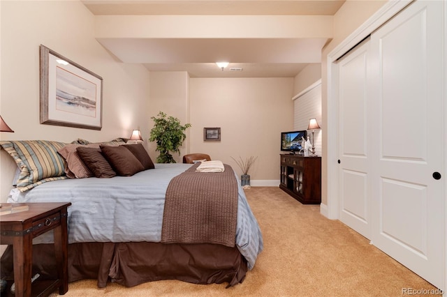 carpeted bedroom with a closet