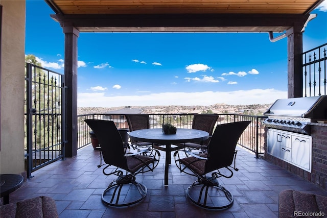 view of patio / terrace with grilling area and an outdoor kitchen