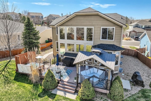 7378 Geode Ct, Castle Rock, CO 80108 - back of property with a deck, a fenced backyard, a residential view, and a shingled roof