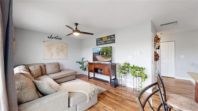10759 Clermont St, Thornton, CO 80233 - living area featuring ceiling fan and light wood-style floors