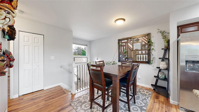 10759 Clermont St, Thornton, CO 80233 - dining area featuring light wood-style flooring and baseboards