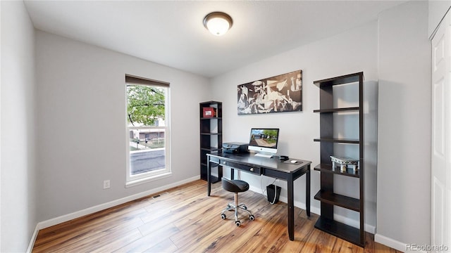 10759 Clermont St, Thornton, CO 80233 - home office featuring wood finished floors and baseboards