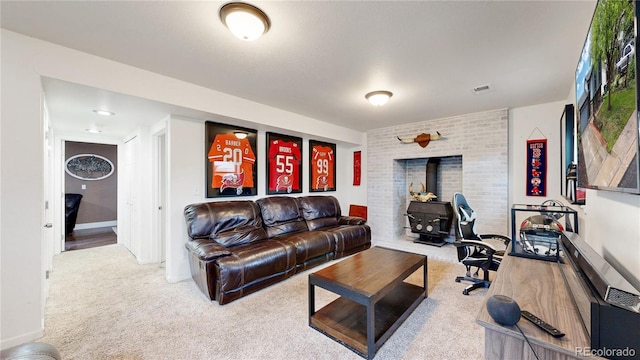 10759 Clermont St, Thornton, CO 80233 - living room with a wood stove and carpet flooring