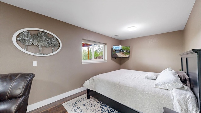 10759 Clermont St, Thornton, CO 80233 - bedroom featuring dark wood-style floors and baseboards