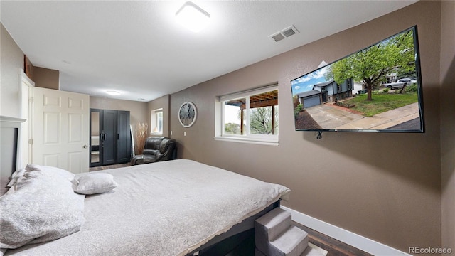 10759 Clermont St, Thornton, CO 80233 - bedroom featuring baseboards and wood finished floors