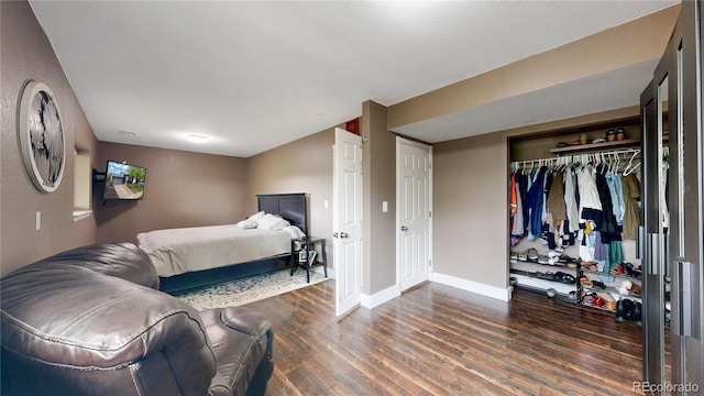 10759 Clermont St, Thornton, CO 80233 - bedroom featuring wood finished floors and a closet