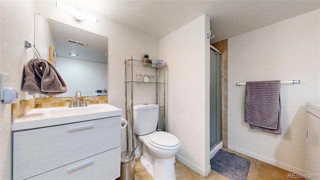 10759 Clermont St, Thornton, CO 80233 - full bathroom with vanity, a stall shower, and tile patterned flooring