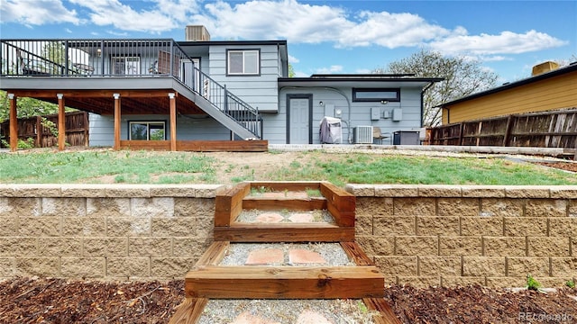 10759 Clermont St, Thornton, CO 80233 - back of house featuring stairs, a deck, and a chimney