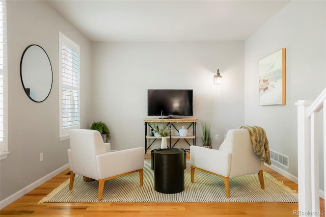 8427 E 35th Ave, Denver, CO 80238 - living area featuring wood finished floors and baseboards