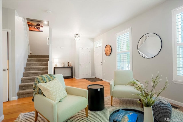 8427 E 35th Ave, Denver, CO 80238 - living room featuring stairs, wood finished floors, and healthy amount of natural light