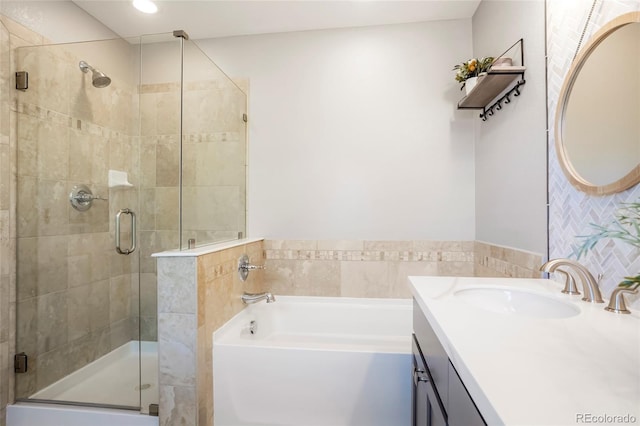 8427 E 35th Ave, Denver, CO 80238 - bathroom with a garden tub, vanity, a stall shower, and recessed lighting