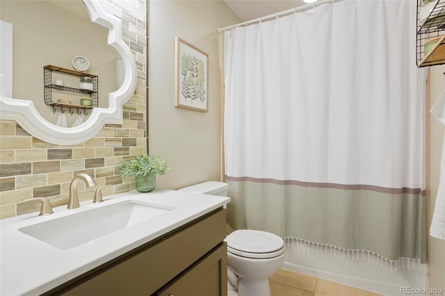 8427 E 35th Ave, Denver, CO 80238 - full bath with decorative backsplash, toilet, vanity, and tile patterned floors