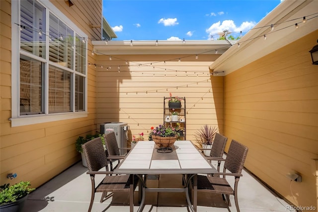 8427 E 35th Ave, Denver, CO 80238 - view of patio / terrace with central air condition unit and outdoor dining space