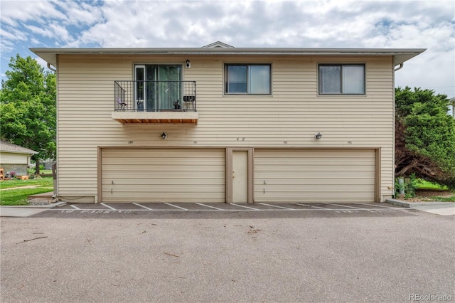 3351 S Field St Unit 191, Lakewood, CO 80227 - view of front of house with an attached garage and a balcony