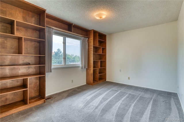 3351 S Field St Unit 191, Lakewood, CO 80227 - unfurnished room featuring carpet flooring, baseboards, and a textured ceiling