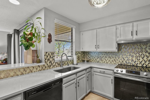 kitchen featuring stainless steel electric range, dishwasher, under cabinet range hood, a sink, and light countertops
