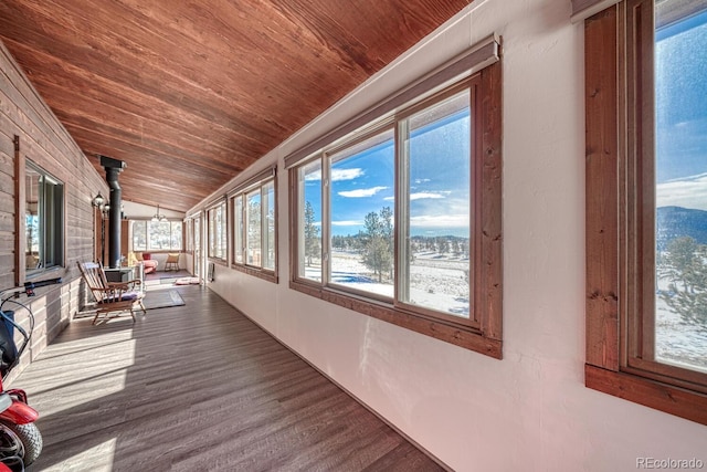 interior space with lofted ceiling and wood ceiling