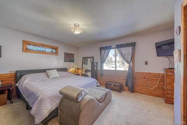 carpeted bedroom featuring wooden walls