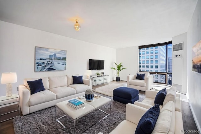 1625 Larimer St Unit 3004, Denver, CO 80202 - living room with expansive windows, wood finished floors, and baseboards