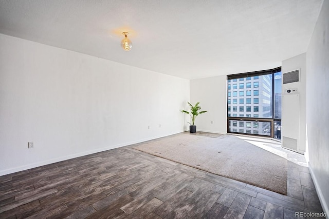 1625 Larimer St Unit 3004, Denver, CO 80202 - unfurnished living room with expansive windows, wood finished floors, and baseboards