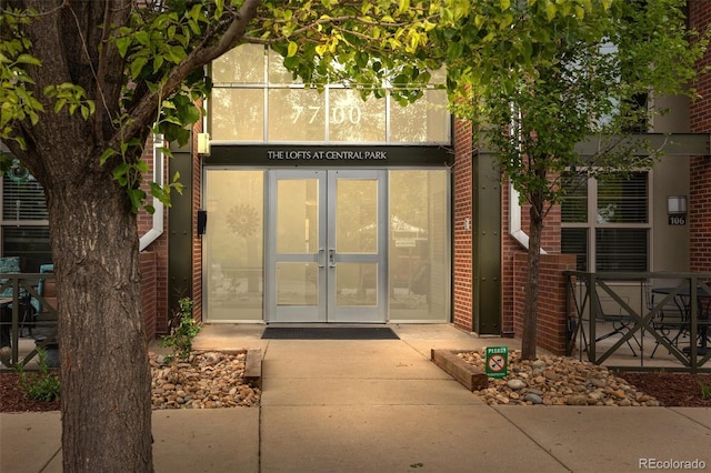 7700 E 29th Ave Unit 102, Denver, CO 80238 - doorway to property with french doors and brick siding