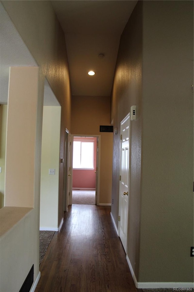 213 Mesa St, Brighton, CO 80601 - hallway with dark wood-style flooring, baseboards, and recessed lighting