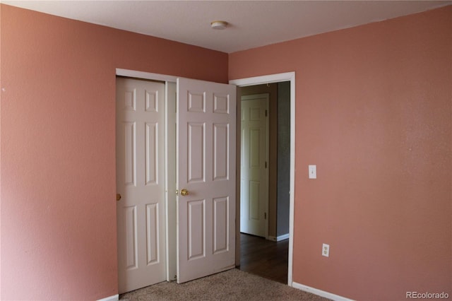 213 Mesa St, Brighton, CO 80601 - unfurnished bedroom featuring carpet flooring, a closet, and baseboards