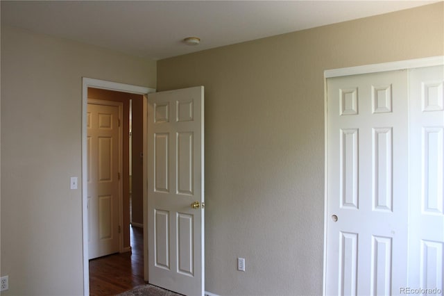 213 Mesa St, Brighton, CO 80601 - unfurnished bedroom featuring dark wood-type flooring and a closet