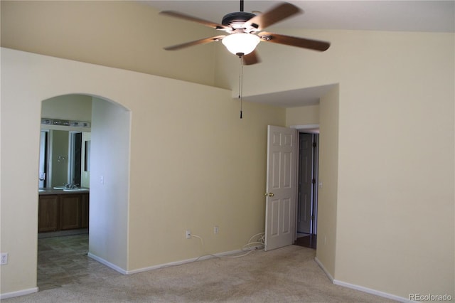 213 Mesa St, Brighton, CO 80601 - unfurnished room with arched walkways, a ceiling fan, light carpet, and baseboards