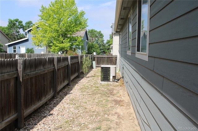 213 Mesa St, Brighton, CO 80601 - fenced backyard with central AC unit
