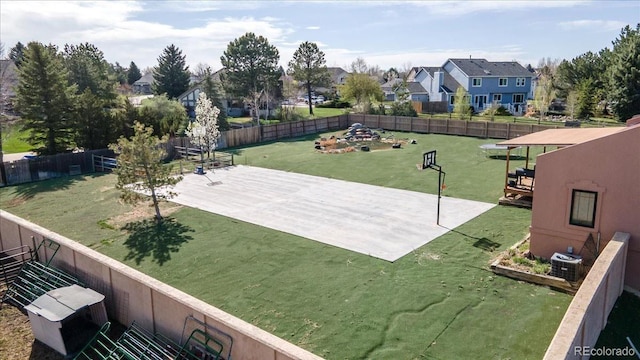 exterior space with a residential view, central air condition unit, a fenced backyard, and a patio area