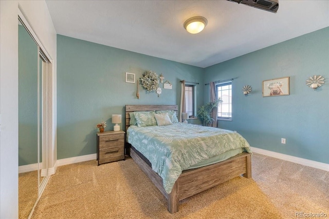 bedroom featuring baseboards and carpet